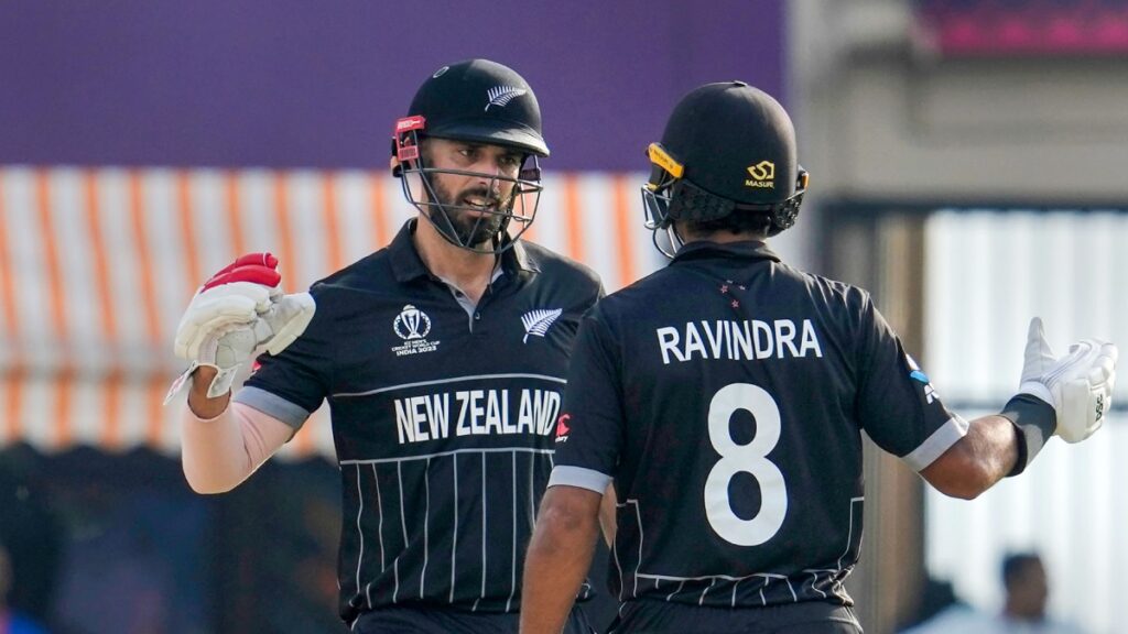 Rachin Ravindra and Daryl Mitchell shake hands